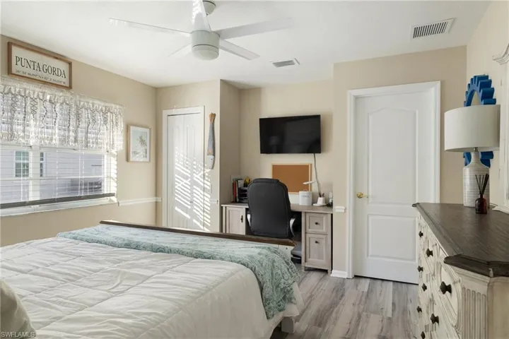 Bedroom featuring ceiling fan and light wood-type flooring