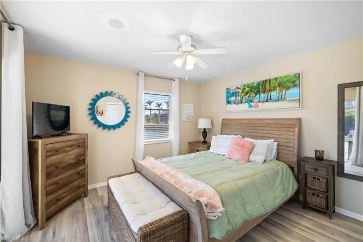 Bedroom with light wood-type flooring and ceiling fan