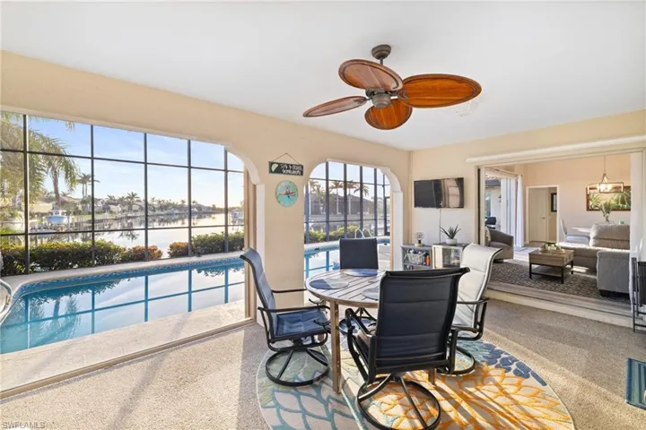 Dining area featuring ceiling fan and carpet floors
