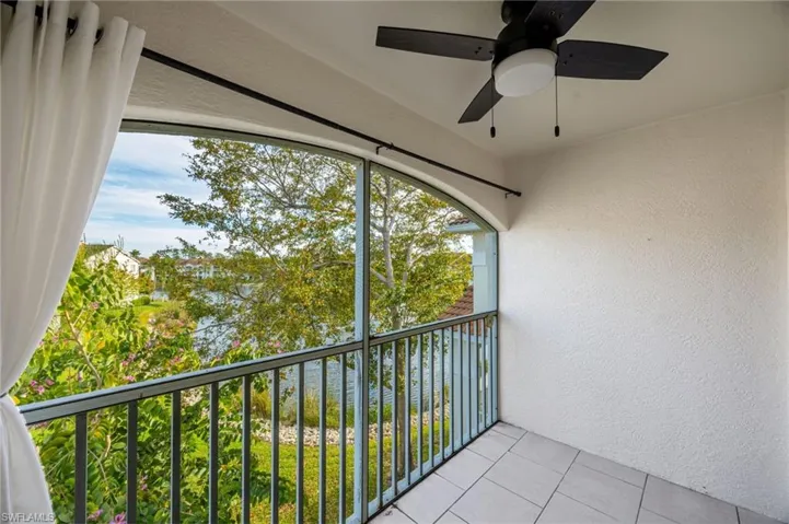 Balcony featuring ceiling fan