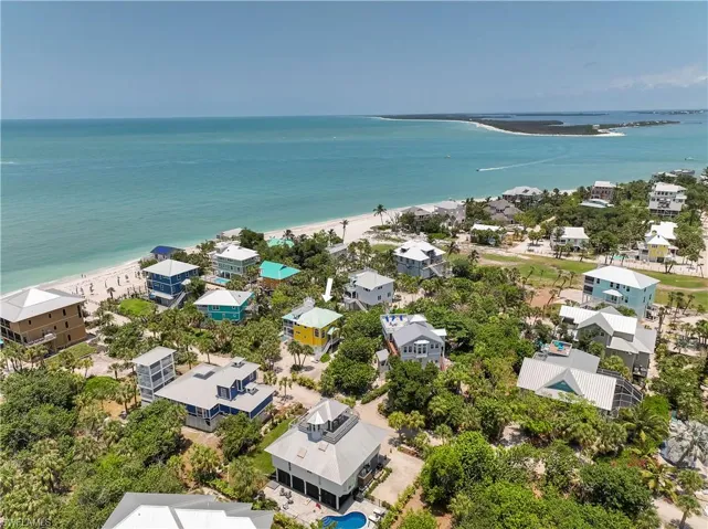 Birds eye view of property with a water view