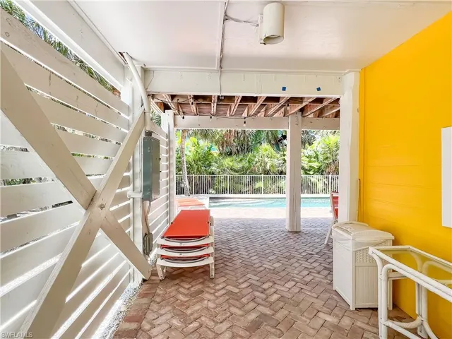 Garage with a fenced in pool