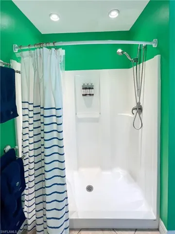 Bathroom featuring walk in shower