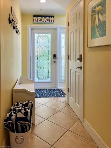 Foyer with light tile floors