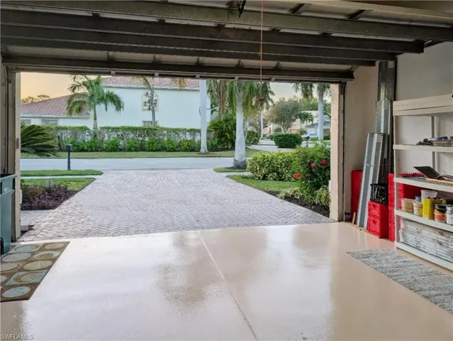 View of garage at dusk