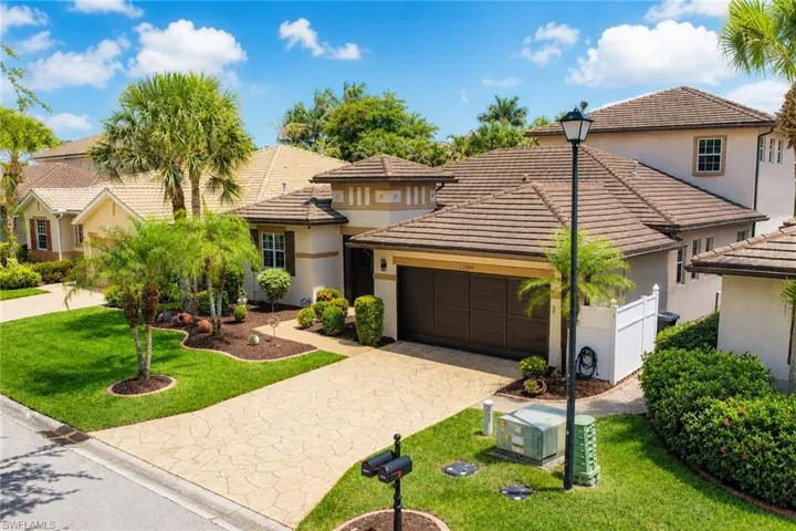 Mediterranean-style residence featuring a tile roof and stucco exterior
