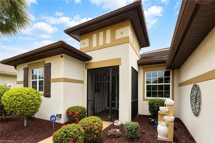 Stucco exterior with multi-toned facade accents and dark brown eaves