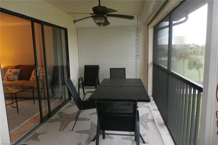 Sunroom featuring ceiling fan
