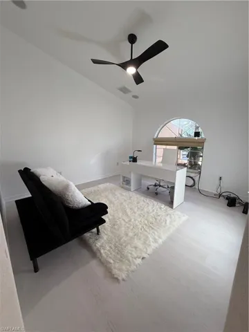 Office featuring wood finished floors and lofted ceiling