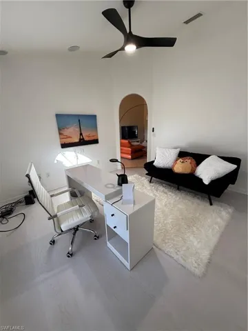 Home office featuring arched walkways