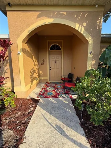 Property entrance with stucco siding