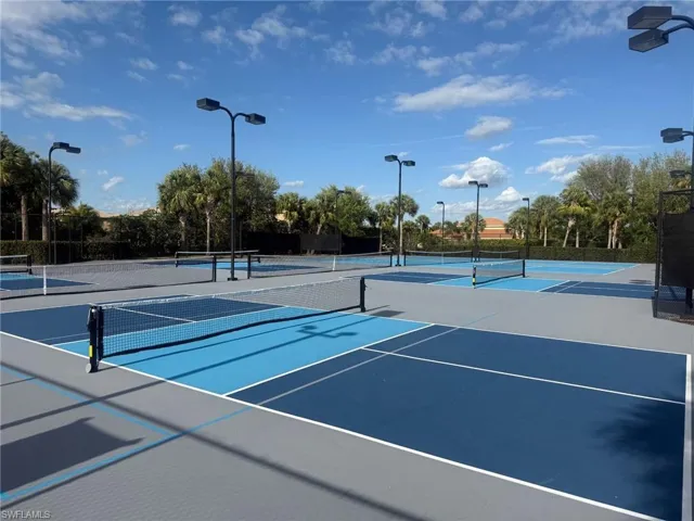 View of sport court featuring community basketball court and fence