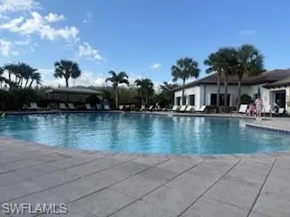 Community pool featuring a patio area