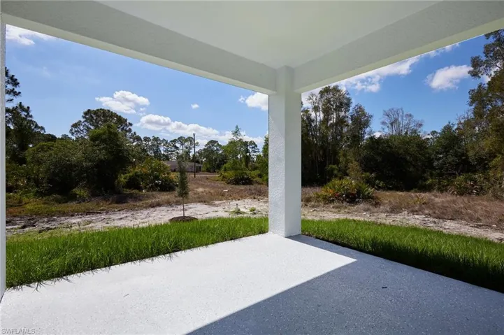View of patio with view of wooded area