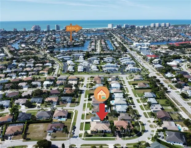 View of property location with a nearby body of water and nearby suburban area