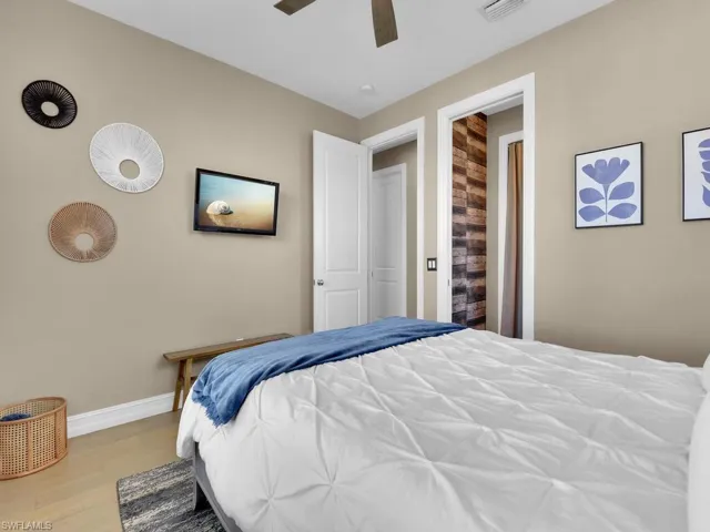 Bedroom featuring ceiling fan and light wood-type flooring