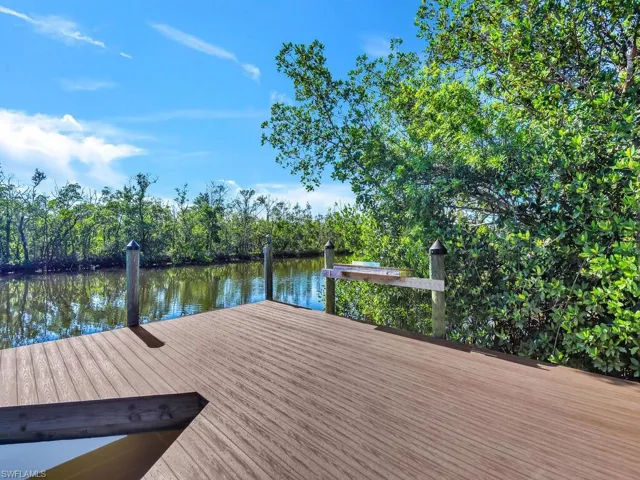 Dock area featuring a water view
