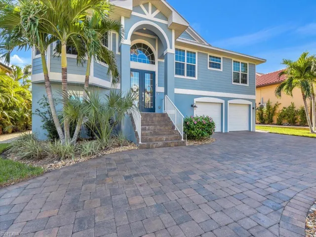 View of front of property with french doors and garage
