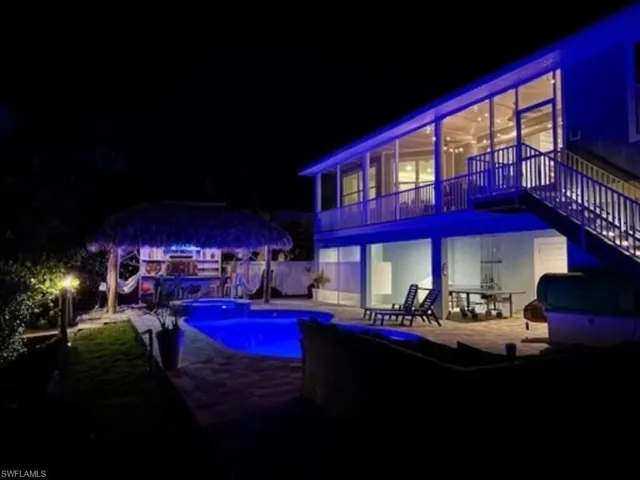Twilight view of pool area