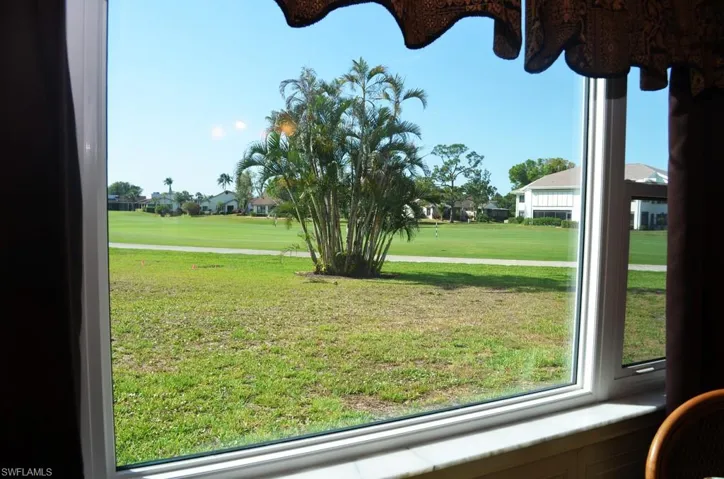 View of grassy yard featuring a residential view and view of golf course