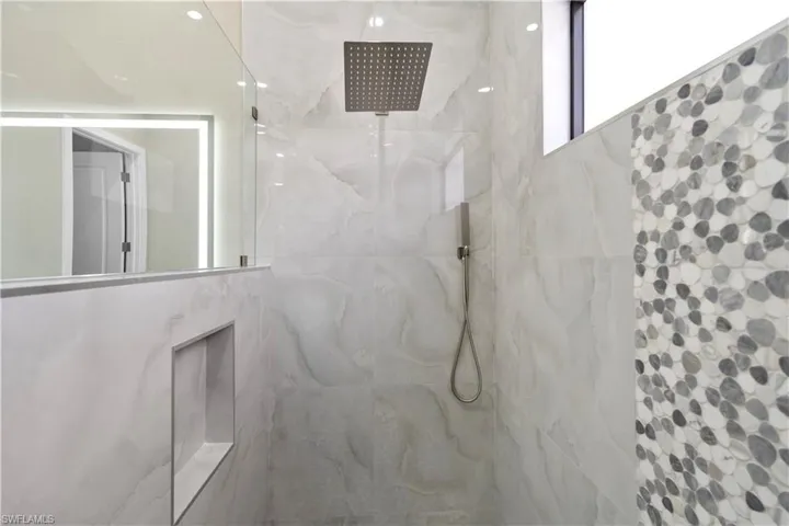 Master Full bathroom with a marble finish shower