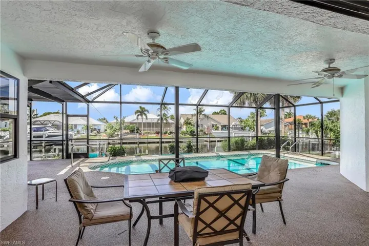Covered lanai area with outdoor seating