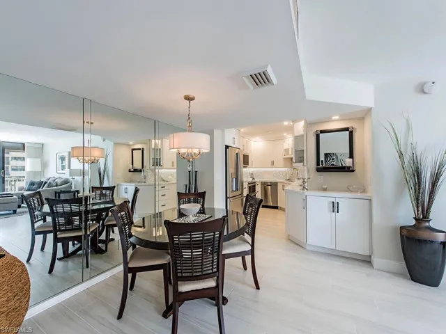 Dining space featuring light wood-style floors and a chandelier