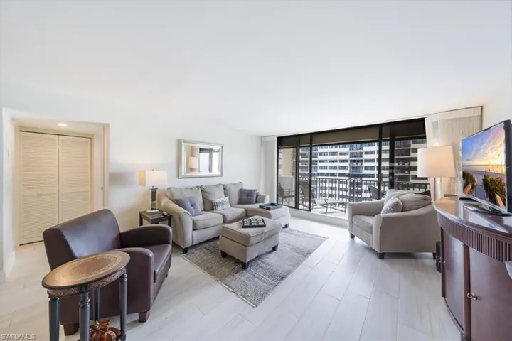 Living area featuring a wall of windows