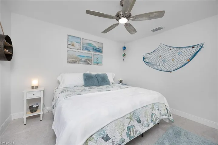 Bedroom featuring a ceiling fan and light tile patterned floors
