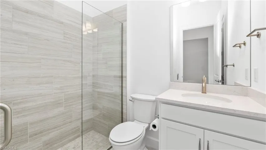 Guest bathroom with a shower stall and vanity