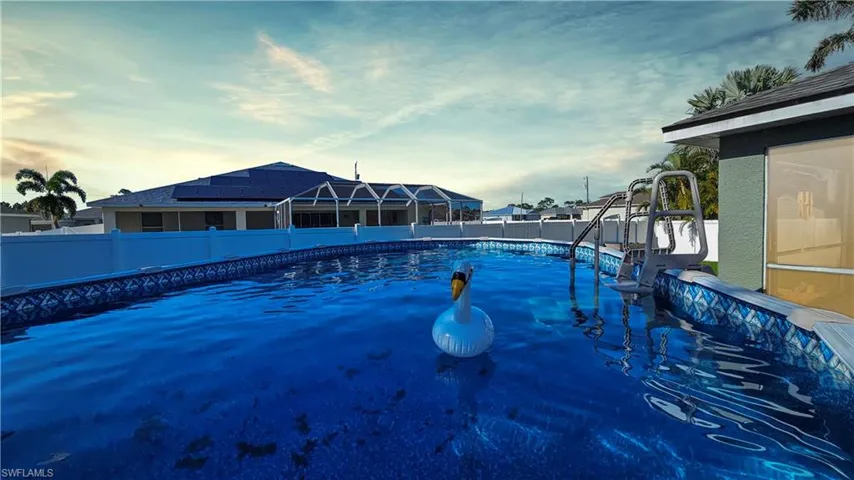 View of swimming pool with a fenced in pool and a fenced backyard