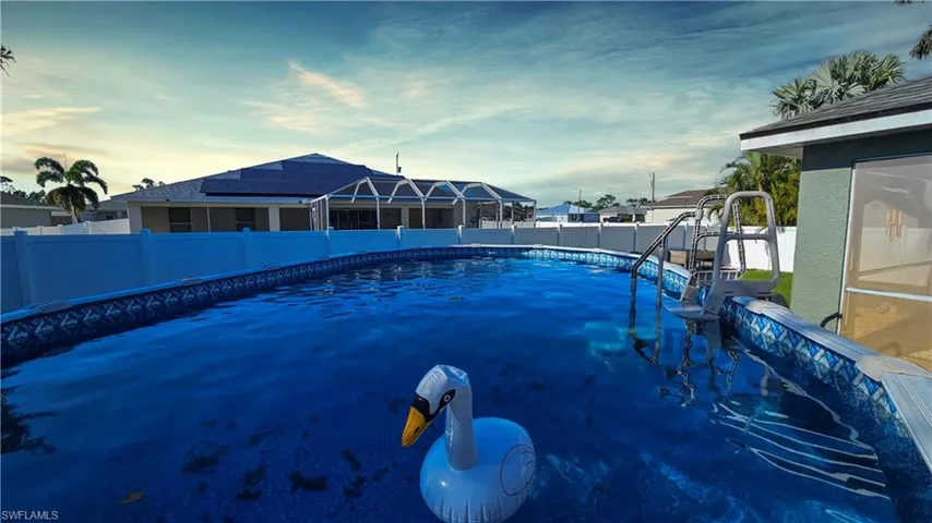 View of swimming pool with a fenced in pool and a fenced backyard