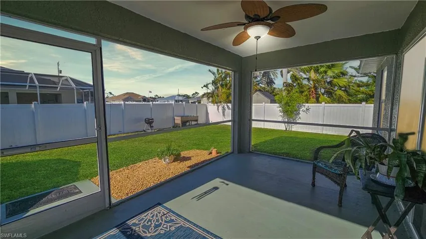 Sunroom with a ceiling fan