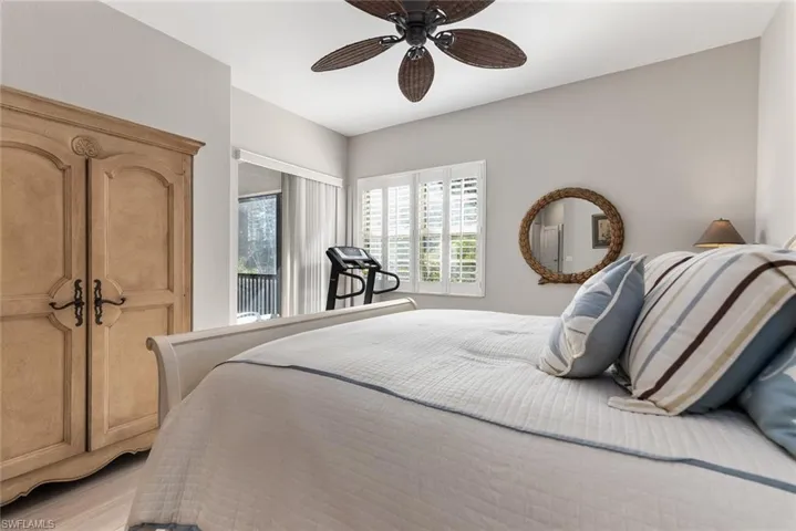 Bedroom featuring ceiling fan and access to outside