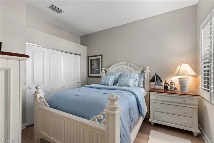 Bedroom with a closet and light wood-style floors
