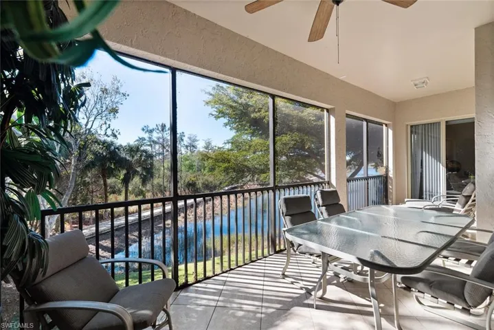 Sunroom featuring ceiling fan and outdoor dining area