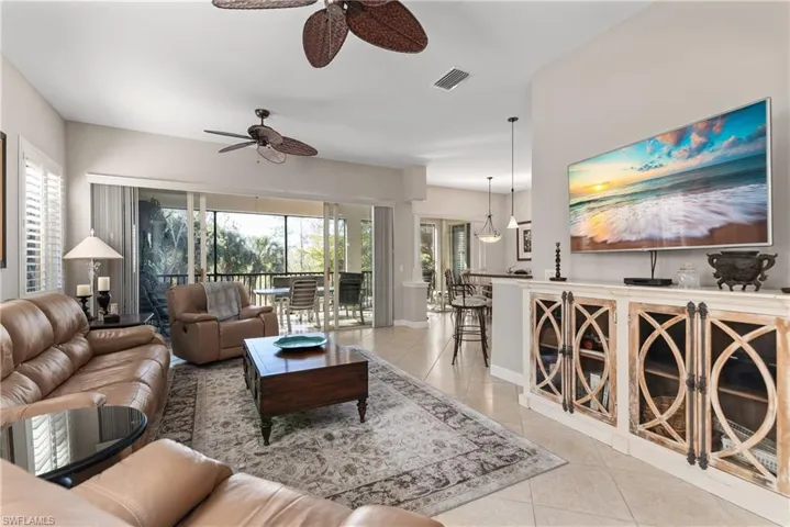 Living area with light tile patterned flooring