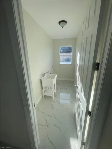 Bathroom featuring vanity, an enclosed shower, tile patterned flooring, and toilet
