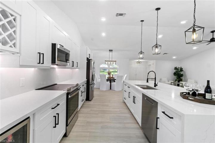 Kitchen, featuring new white shaker-cabinetry, stainless steel appliances and quartz countertops