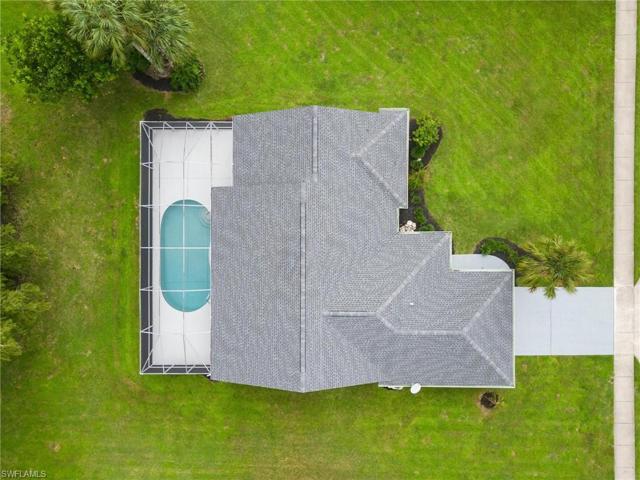 Top of home and pool, featuring newer roof and expansive yard