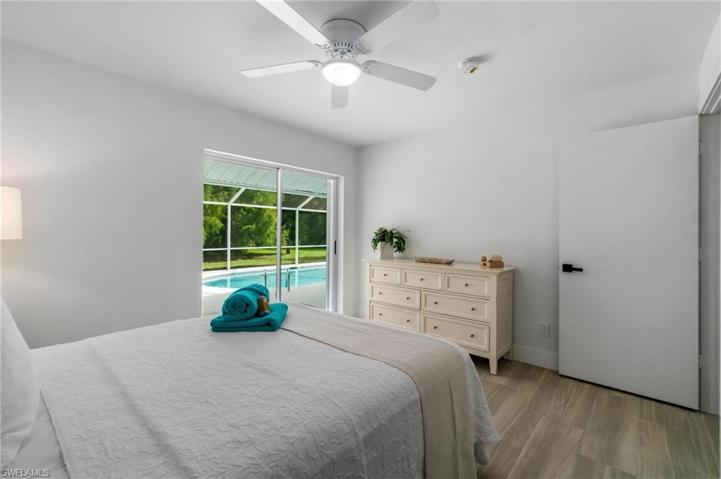 second guest bedroom - queen size bed & sliders to lanai