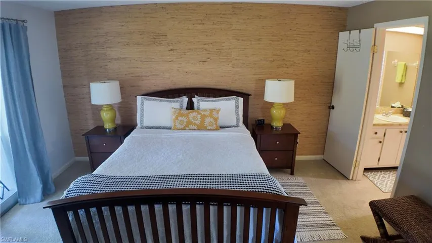 The primary bedroom has a sliding door to the lanai.