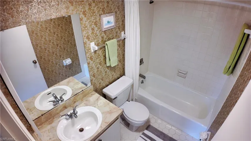 This bathroom has a tub/shower combo.