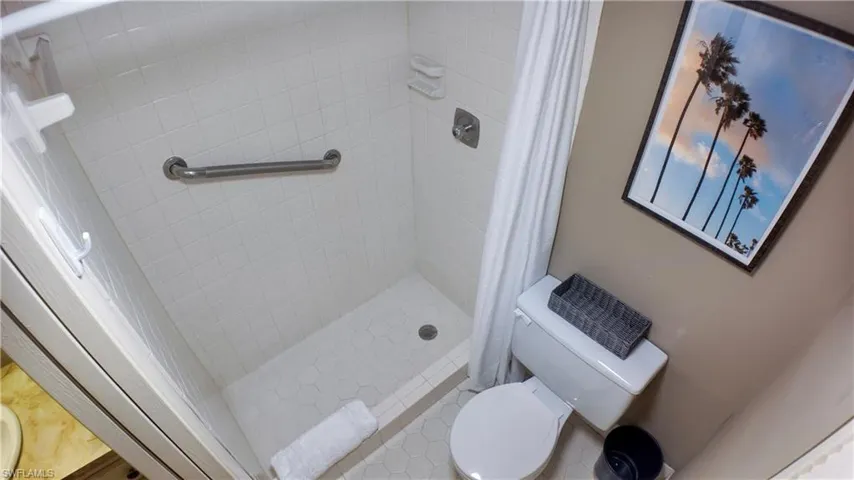 The primary bathroom features a walk-in shower.