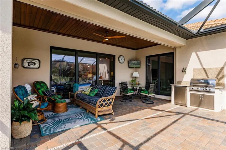 View of patio / terrace featuring area for grilling, an outdoor kitchen, and ceiling fan