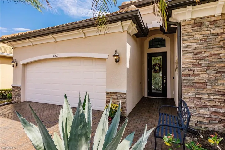 Front entrance with glass paneled front door.