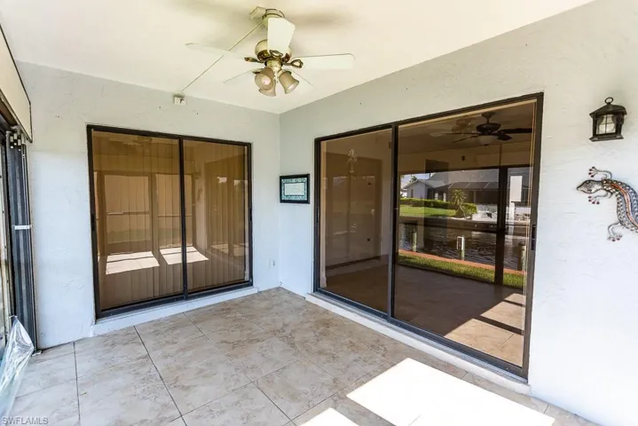 View of patio featuring ceiling fan