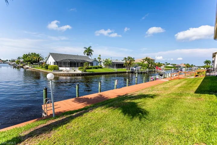 View of water feature with a dock