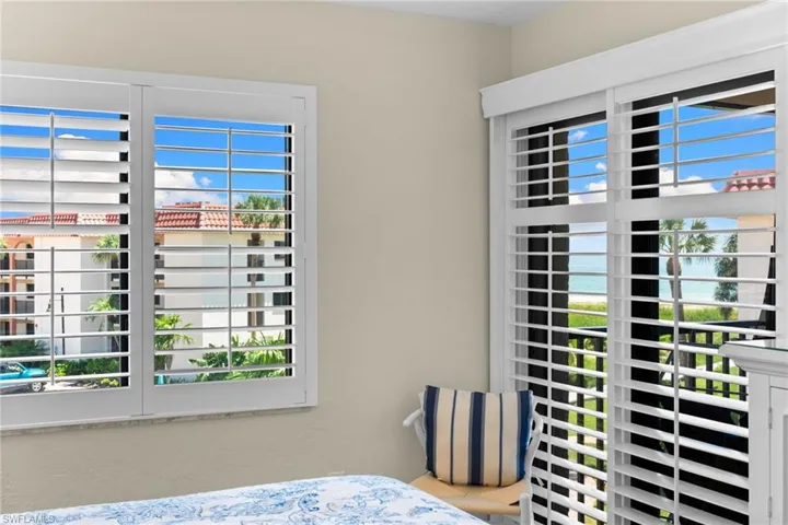 Plantation shutters on windows and sliding glass door