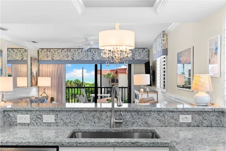Granite countertop with integrated stainless steel sink and gooseneck faucet